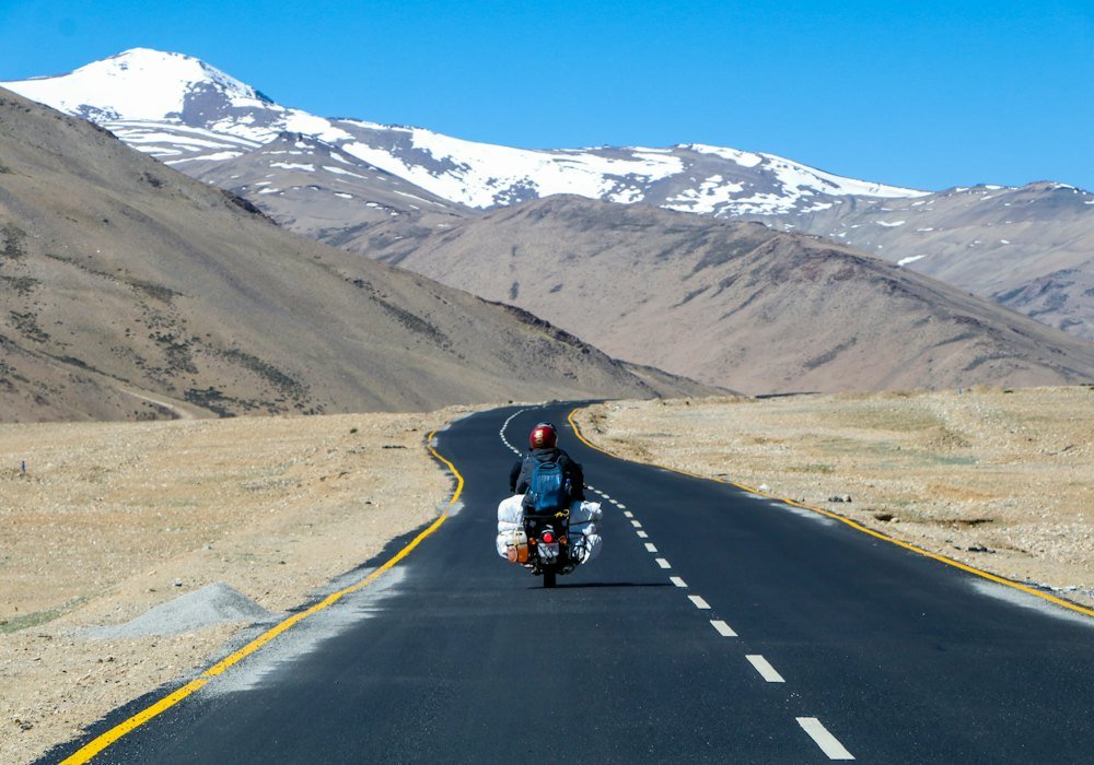 Biker on a mountain road in Ladakh